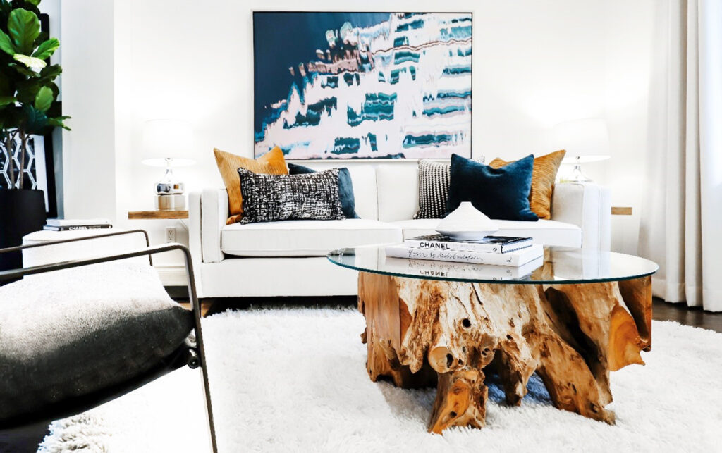 The standout feature in this after photo is the coffee table. Its bold style not only captures attention but also harmonizes with the surrounding rental furniture, creating a wonderful focal point.