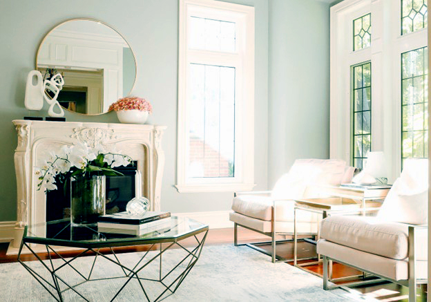 After: A transformation is evident with walls painted in lighter shades, complemented by tasteful rental furniture and beautiful accessories. The removal of the curtains stands out as the most significant change, instantly brightening and refreshing the space.