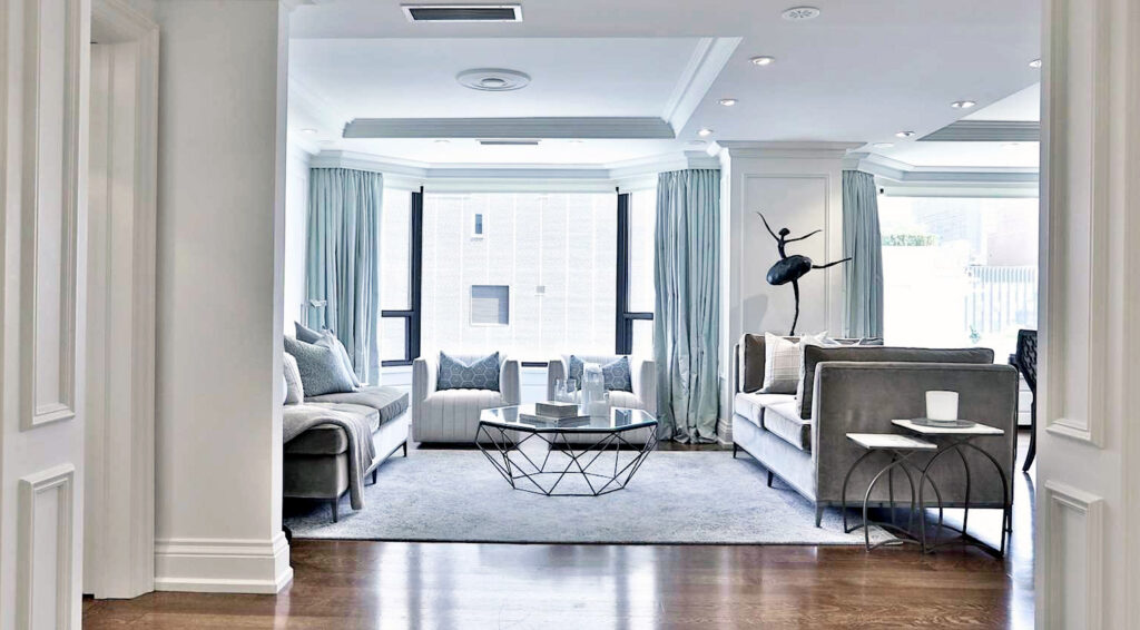 In this after photo, all the furniture has been sourced from Stage Right Rentals, with the exception of the sofas and the sculpture. The sculpture, a piece owned by the homeowner, truly steals the show.